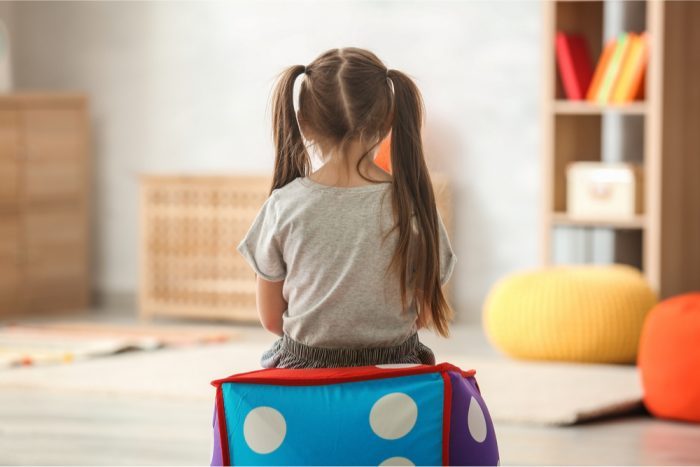 autistic child sitting in therapy session