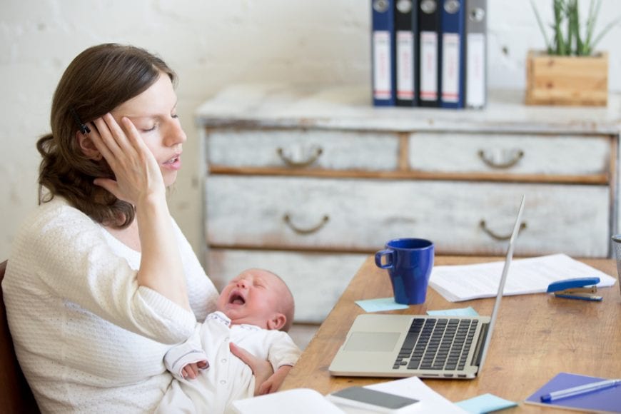 New mom sitting at table overwhelmed