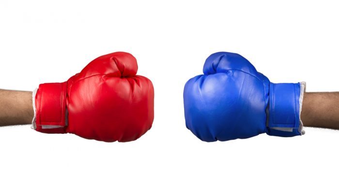 red glove against blue glove